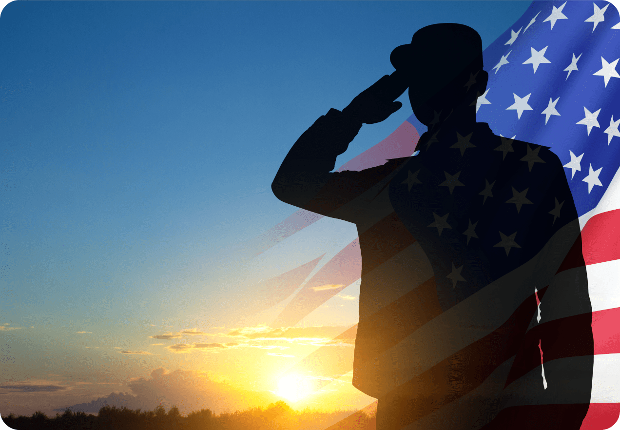 Silhouette of a saluting person overlaid with the American flag, set against a sunset background.