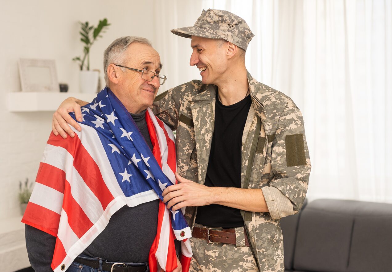 GettyImages-1471822356 A man in uniform and an american flag