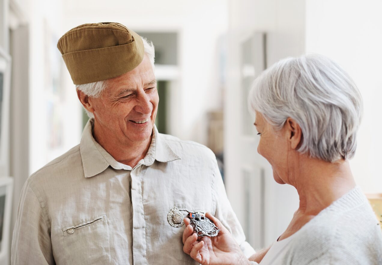 GettyImages-504291719 A man in a hat is talking to an older woman.
