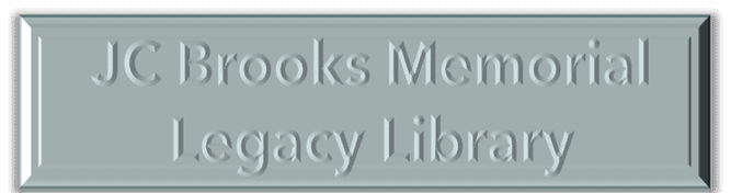 legacy-cropped A gray sign that says books more literacy library.