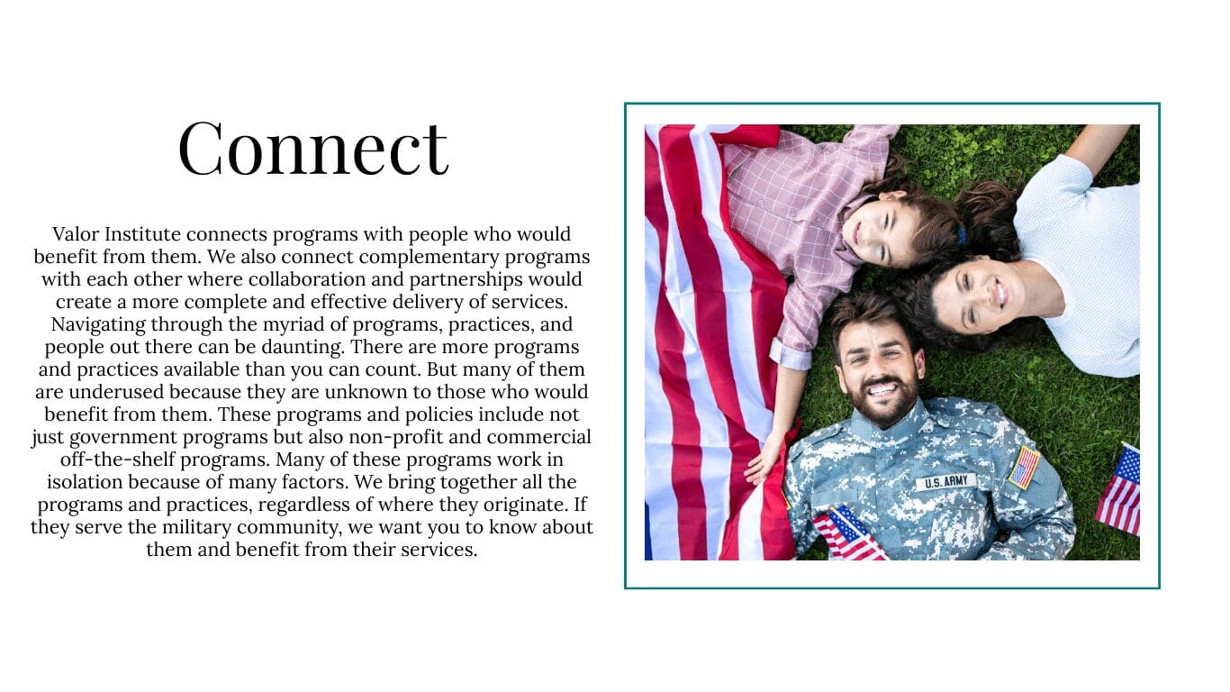 Family lying on grass with American flag.